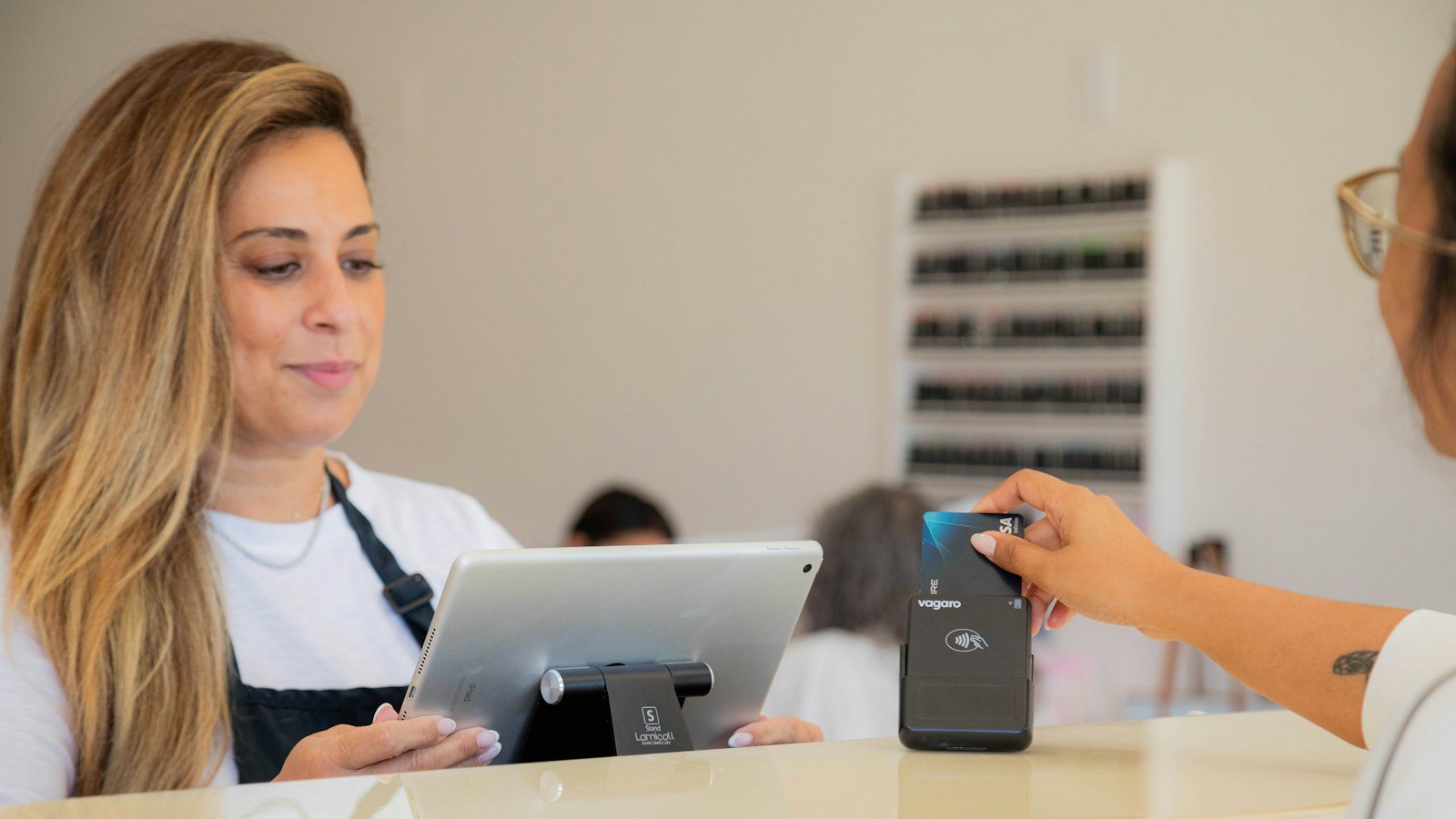 Client paying for a treatment at a beauty salon reception